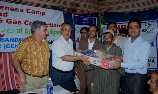 JK Bank distributes LPG gas connections at awareness camp
